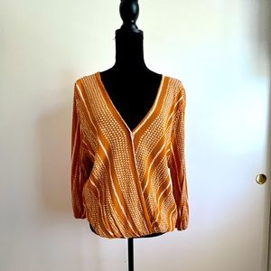 Mustard yellow blouse.